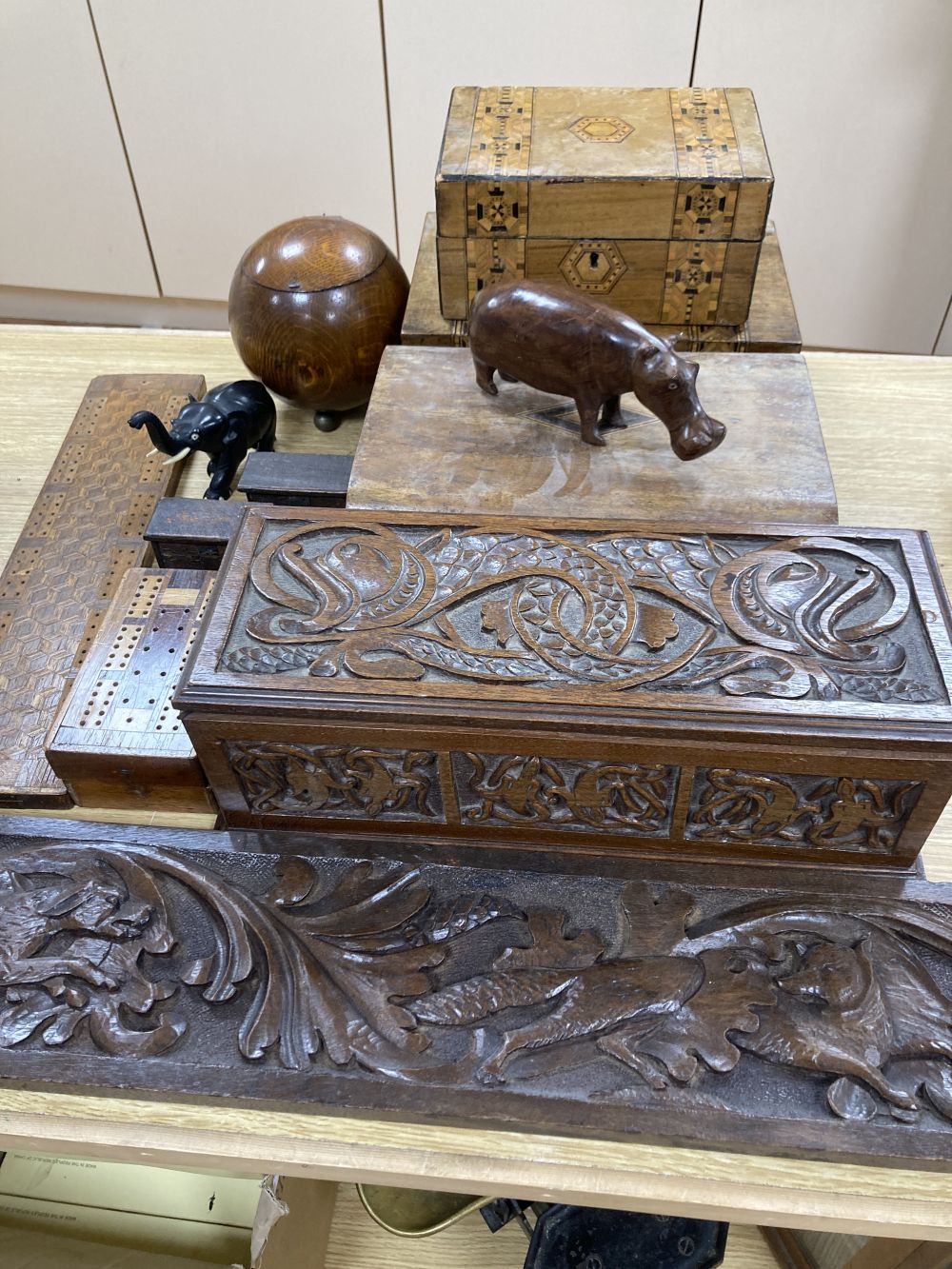 Three inlaid wooden boxes, a carved oak box, two cribbage boards and sundry treen, 19th/20th century